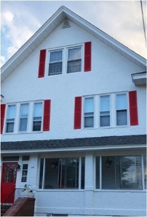 exterior paint job, white house, red shutters