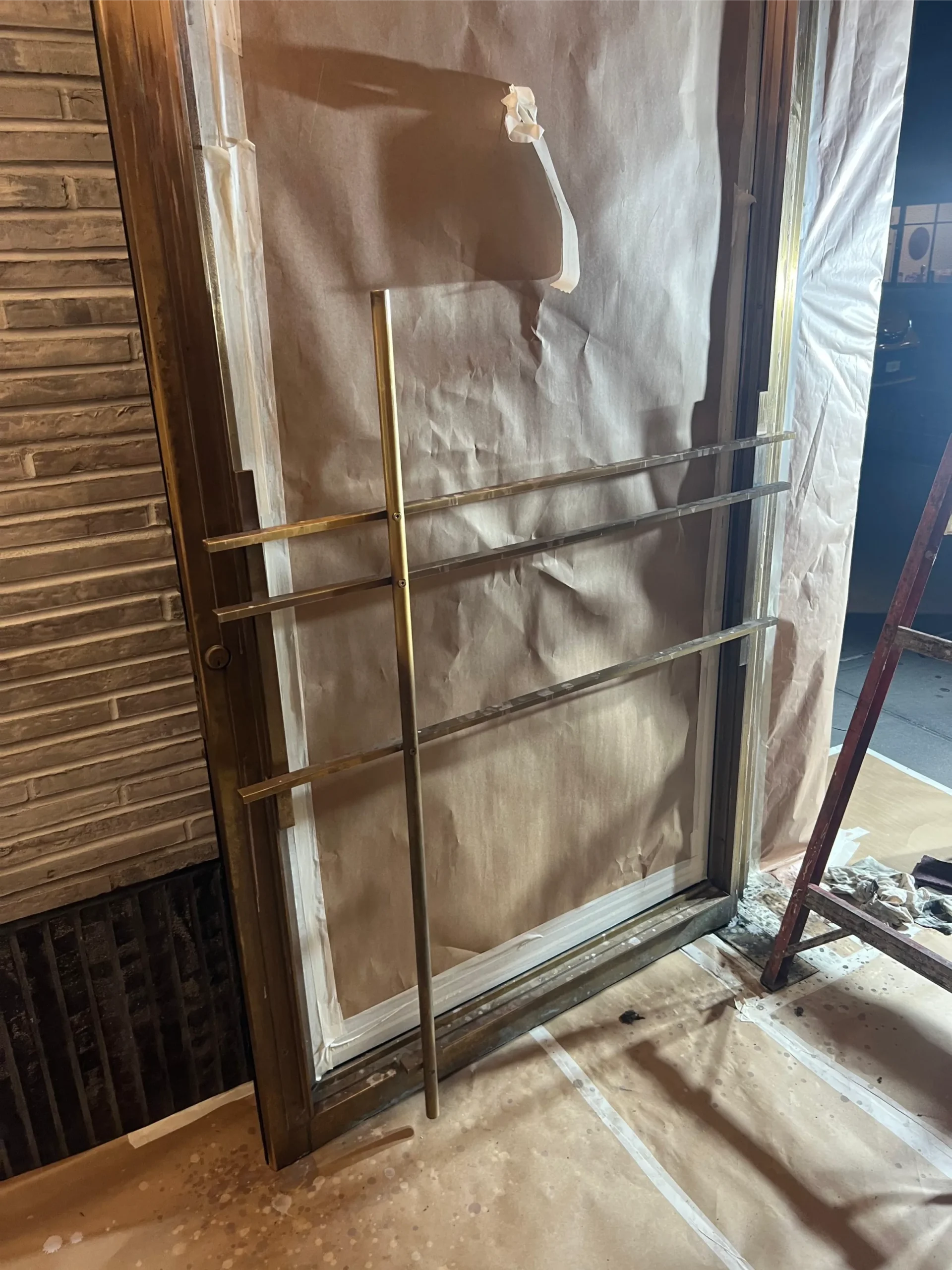 Brass door refinishing in progress